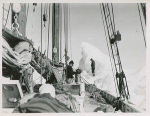 Image: Miriam on berg- Bow of Bowdoin against ice
